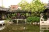 Bridge across the pond inside the garden.