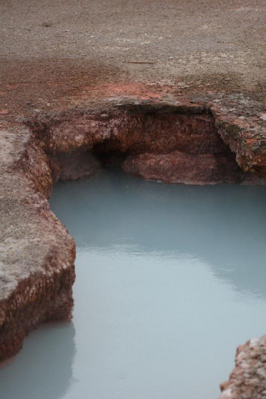 2009-08-02 15:32:42 ** Yellowstone National Park ** Milky blue shimmers the hot water inside this geysir.