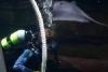 Diver cleans one of the tanks.