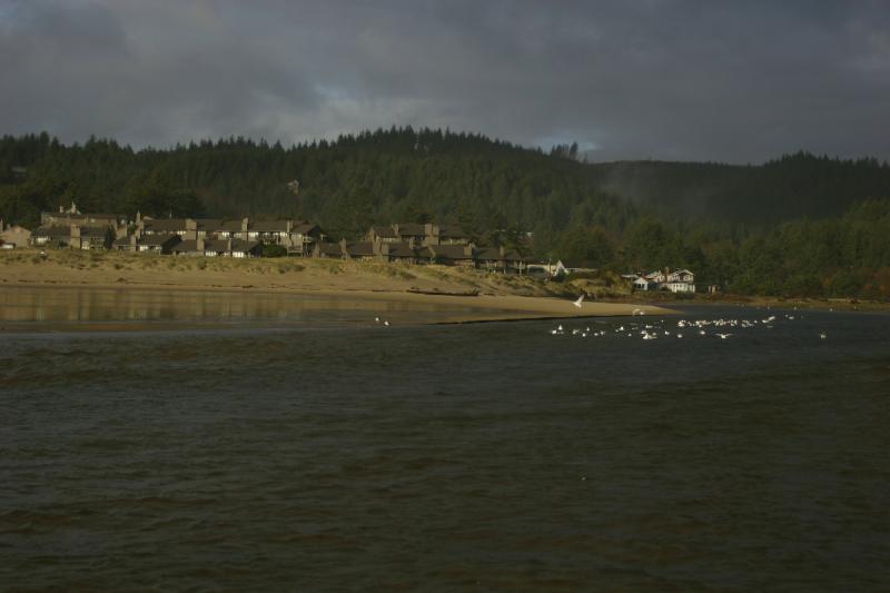 2006-01-28 16:51:22 ** Cannon Beach, Oregon ** Beach front property and clouds in the mountains in the background.