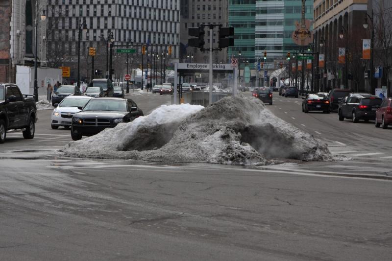 2014-03-08 15:50:48 ** Detroit, Michigan ** One of the corners where a lot of the snow is pushed together. Enough hot air comes from the storm drain to melt some of it.